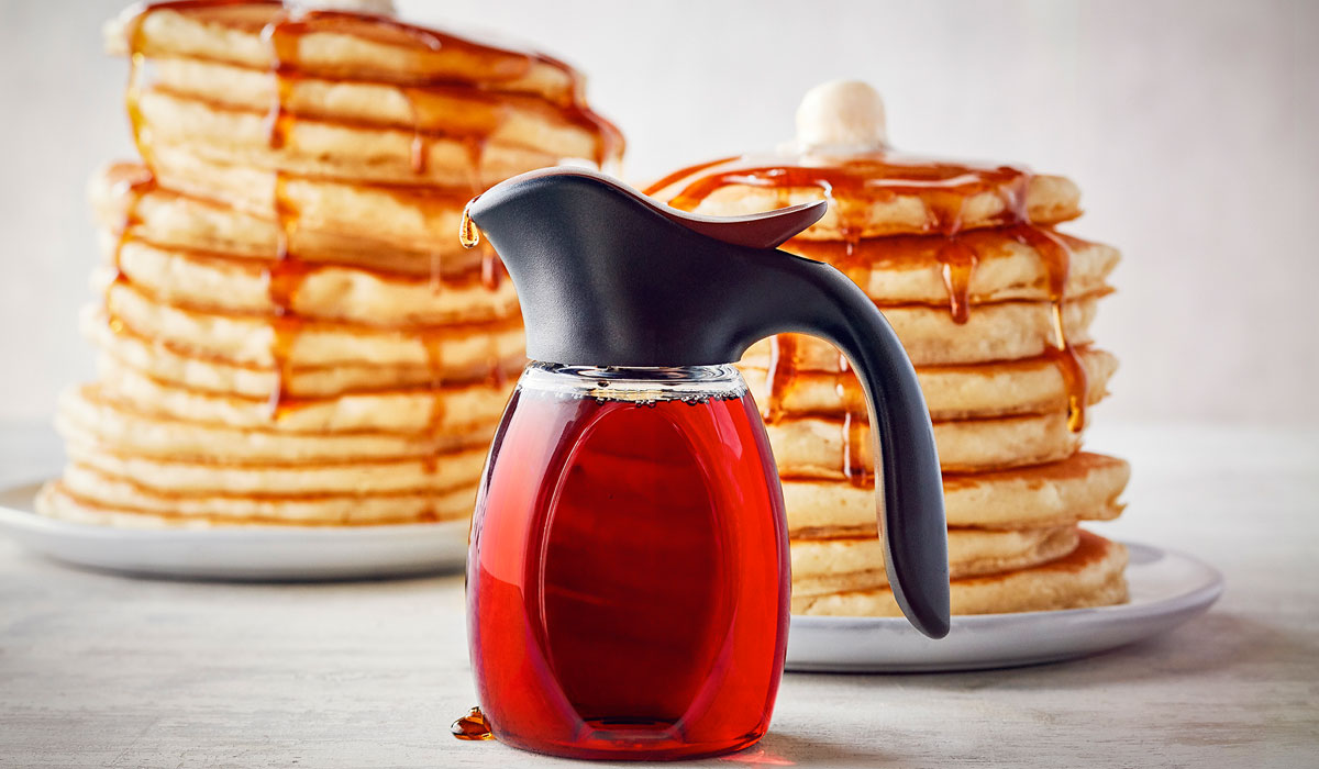 A Stack Of IHOP Pancakes Shown With Syrup, An American Classic That Isn't Going Out Of Style