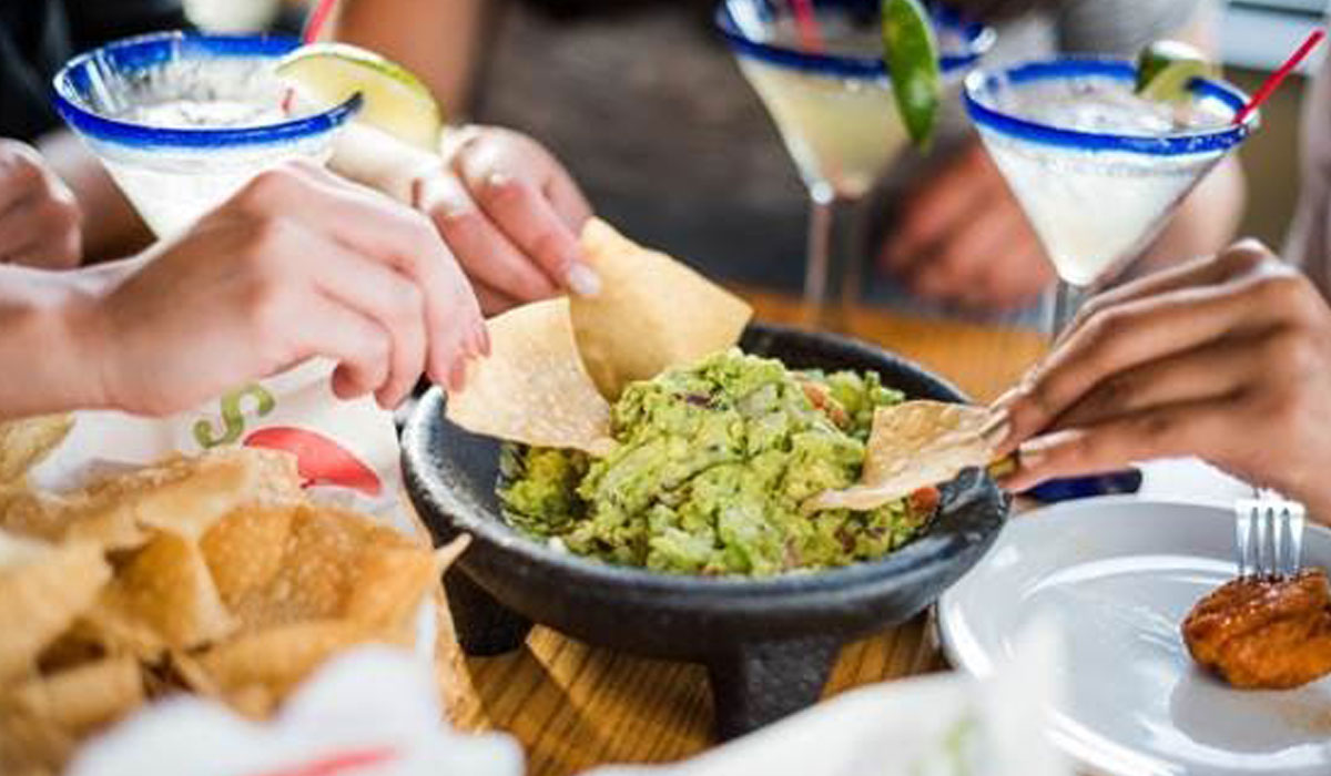 Customers Eat Guacamole At Chili's Restaurant