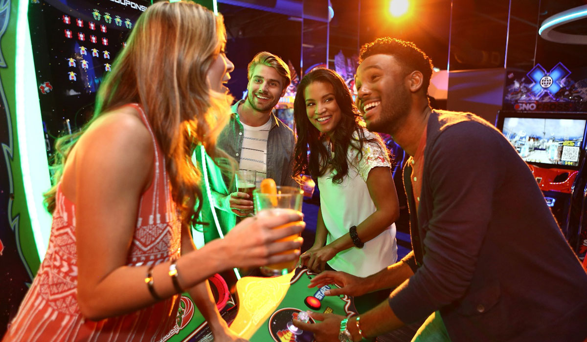 A Group Of People Play A Game At Dave & Buster's