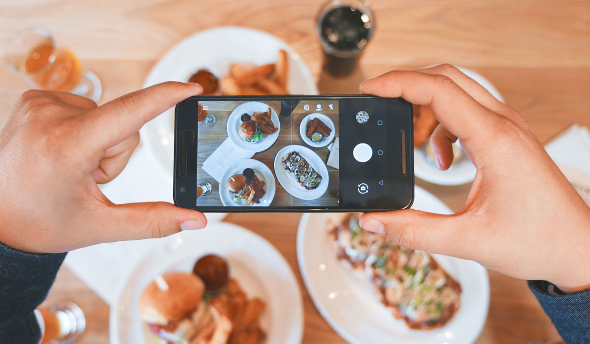 Customer Taking A Photo Of Food With Their Phone