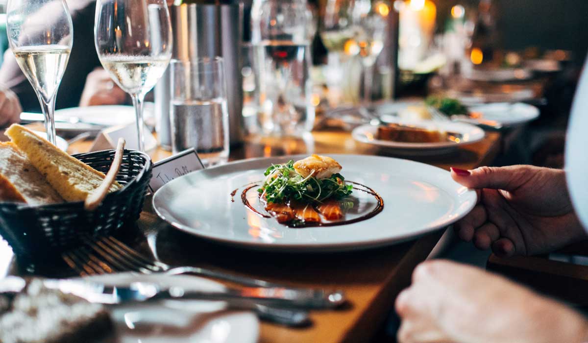 Plate Of Food On A White Tablecloth At A High End Restaurant