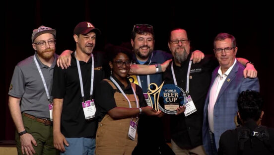 Brewers Daniel Petersen, Seth Mathlery, Brittany Jackson, Matt Gundrum and Chris LaPierre of Iron Hill Brewery and Restaurant accept Gold at the 2024 World Beer Cup.