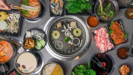 At KPOT, guests use tablets to order a variety of meats, vegetables, and soups, with ingredients cooked hot pot or Korean barbecue style at the table.