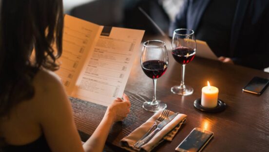Couple dining out with menu.
