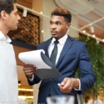 Stock image restaurant manager and employee.