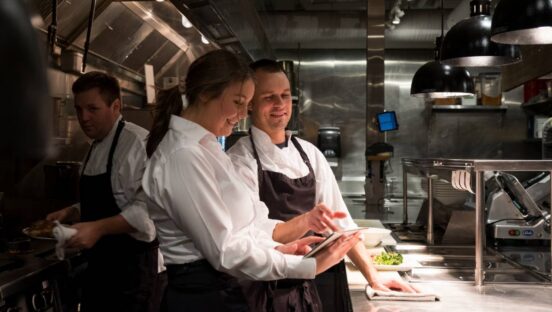 Stock image-restaurant employees in kitchen.