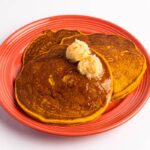 Pumpkin Pancakes with Cinnamon Sugar Butter from The Flying Biscuit Café.